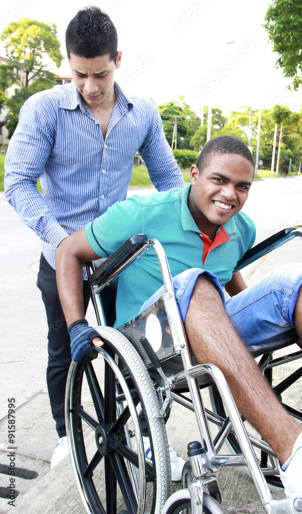 young man in a wheelchair outside young man in a wheelchair outside