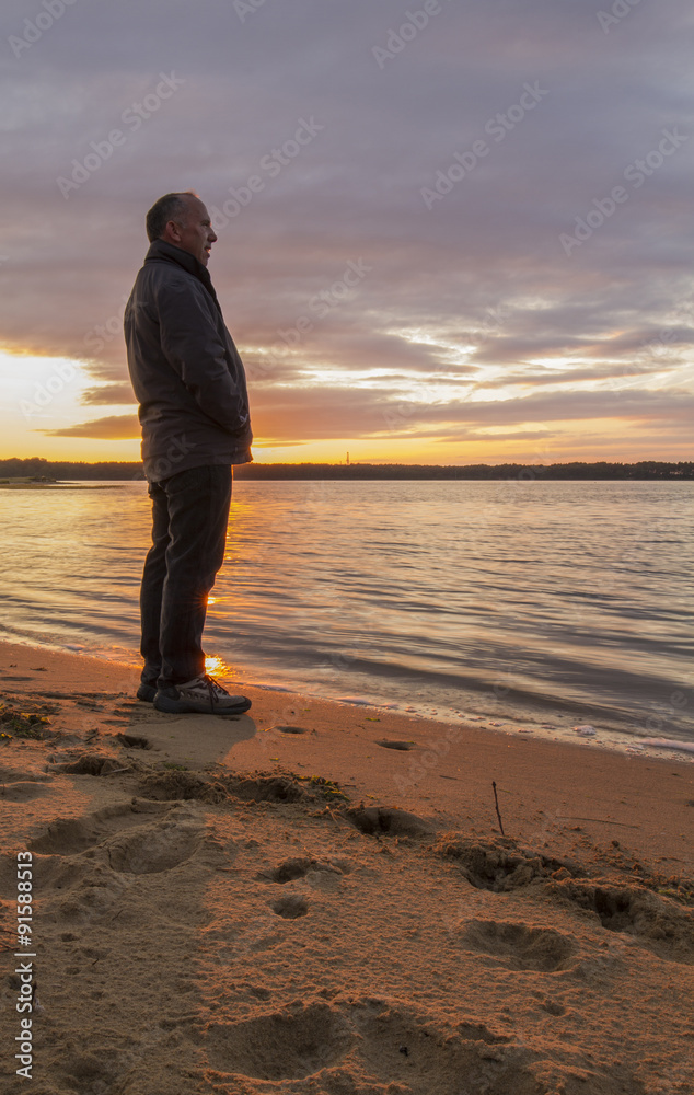 man enjoying view at sunset