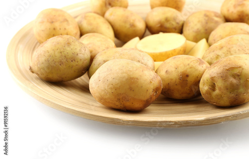 Young potatoes on plate close up