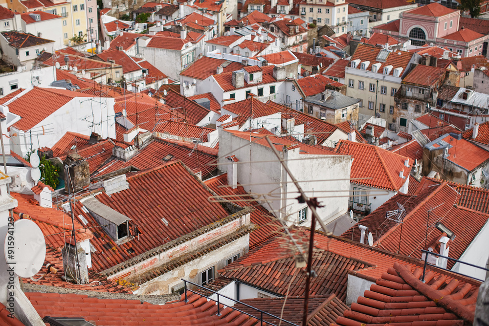 view from the height of the orange roofs of the city
