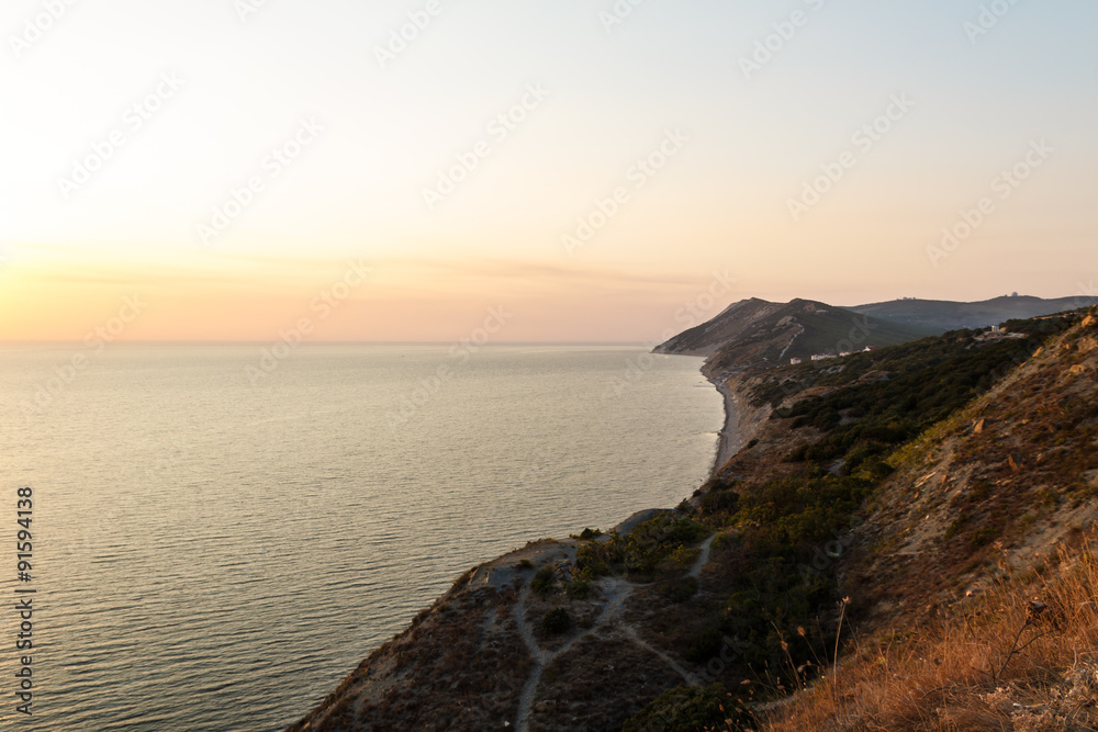 Beautiful sunset by the sea, cliffs and mountains. South resort. Beautiful sunset by the sea, cliffs and mountains. South resort.