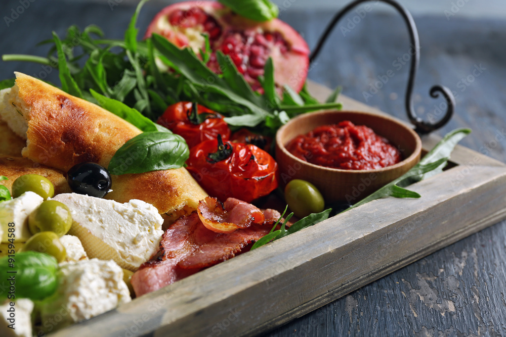 Ingredients of Mediterranean cuisine, on wooden tray, on wooden background