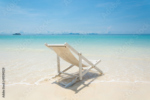 beach chair on beach with blue sky © topntp