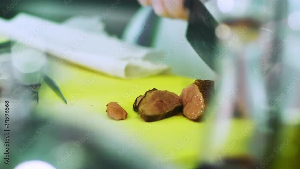 Professional Chef is Slicing Medium Rare Beef with Knife. Shot on RED Cinema Camera in 4K (UHD). Professional Chef is Slicing Medium Rare Beef with Knife. Shot on RED Cinema Camera in 4K (UHD).