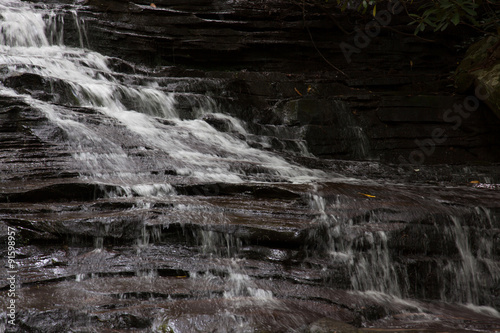 Mountain waterfall, cascading over rocks