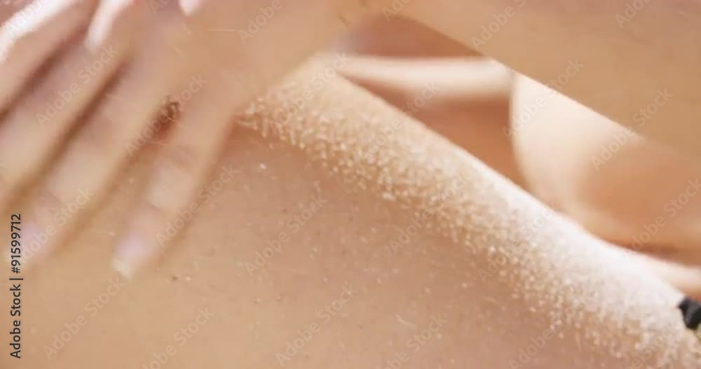 Close up crop beautiful woman body sitting on tropical beach during summer vacation Close up crop beautiful woman body sitting on tropical beach during summer vacation