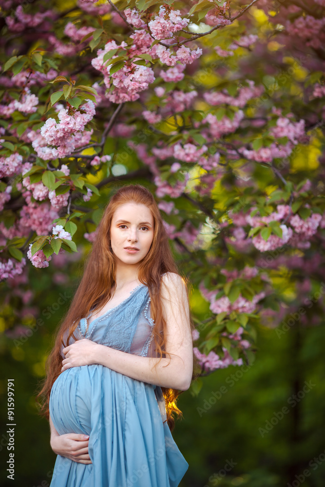 Young pregnant woman relaxing and enjoying life in nature Young pregnant woman relaxing and enjoying life in nature