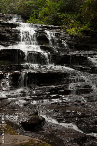 Mountain waterfall tumbling over rocks