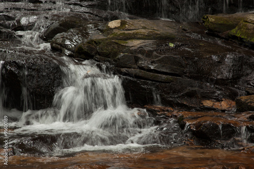 Mountain waterfall tumbling over rocks