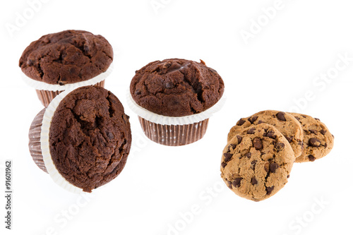 Chocolate chip muffin and cookies isolated on white background.