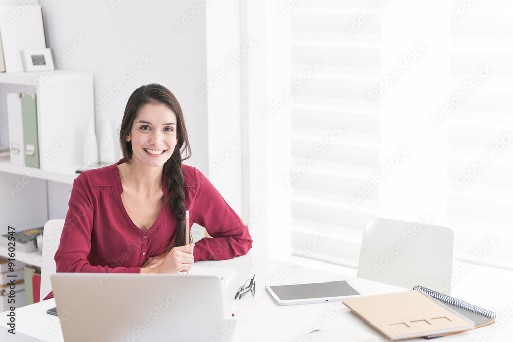 Portrait of an designer working home on new ideas. A dark hair b Portrait of an designer working home on new ideas. A dark hair b
