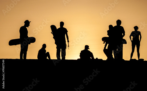 Silhouettes of sand boarders © Matyas Rehak