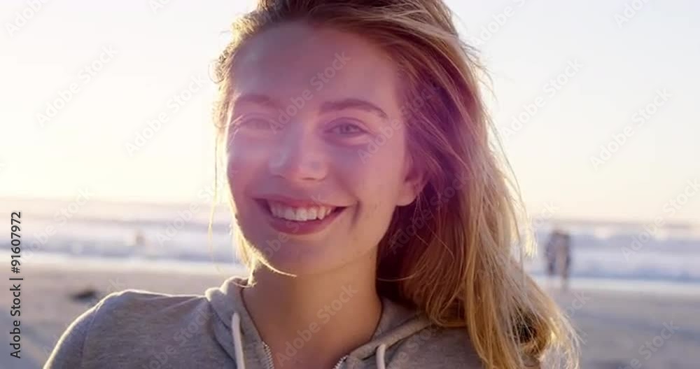 Portrait of beautiful girl smiling on beach at sunset in slow motion Portrait of beautiful girl smiling on beach at sunset in slow motion