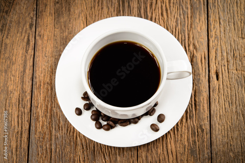 Coffee cup on wood background