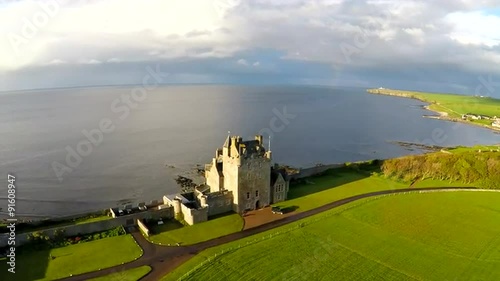 An aerial of a beautiful Scottish or English castle estate in sunset light. photo