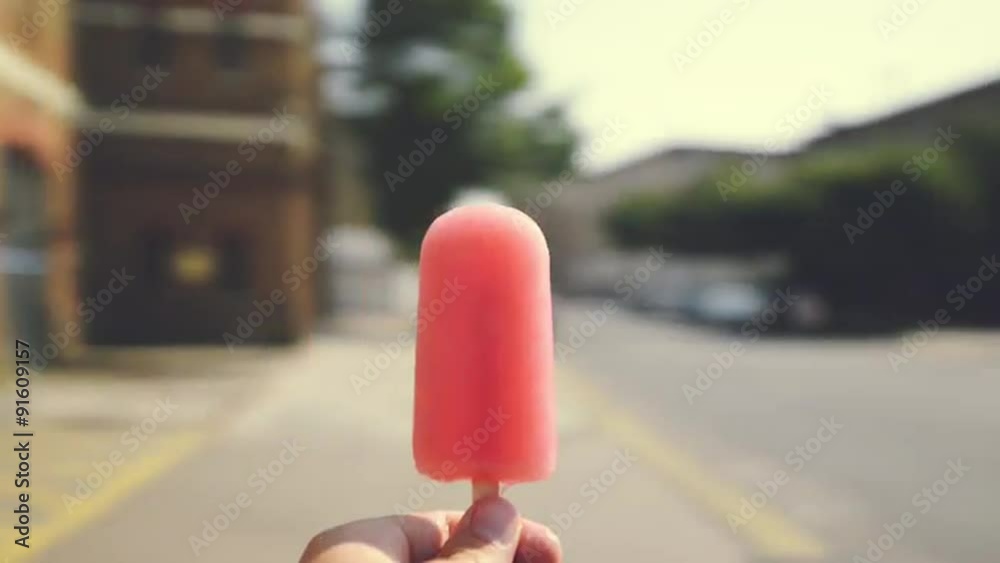 Man holding ice lolly point of view spinning