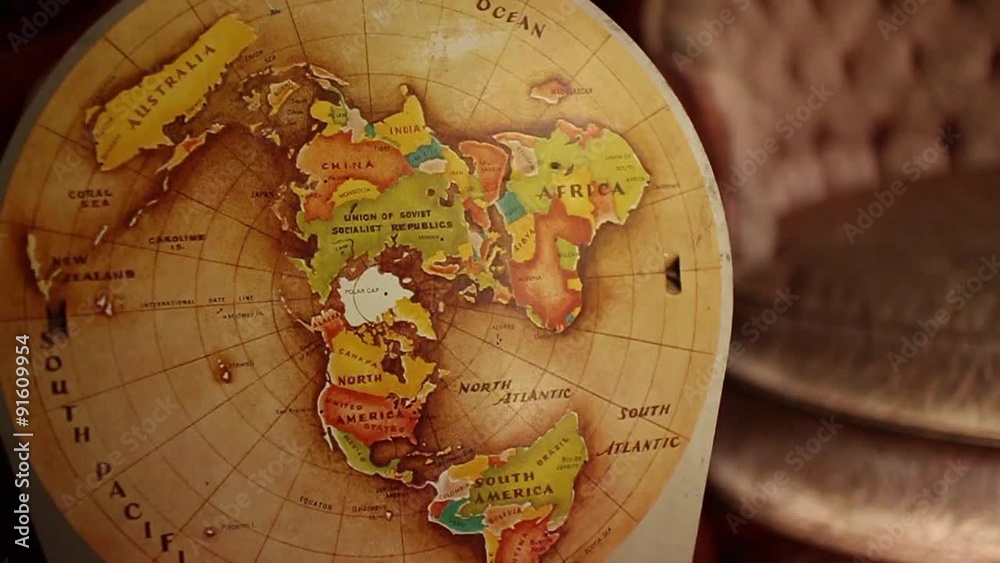 CURRENT SHOT: 60 fps native slow motion circular dolly move back from vintage retro globe-map
