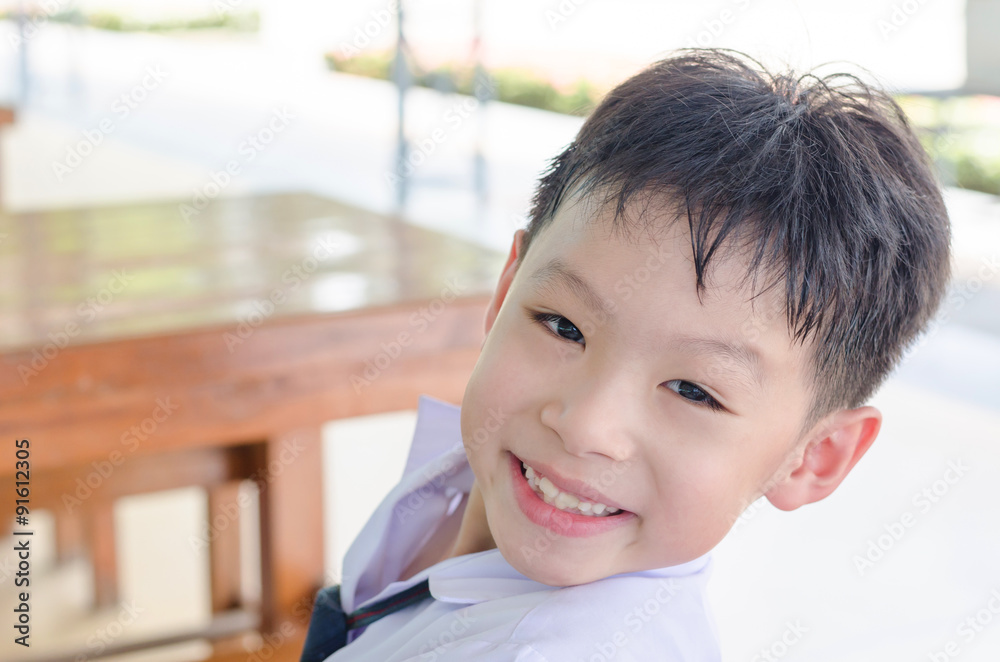 Closeup smiling Asian student face looking at camera Closeup smiling Asian student face looking at camera