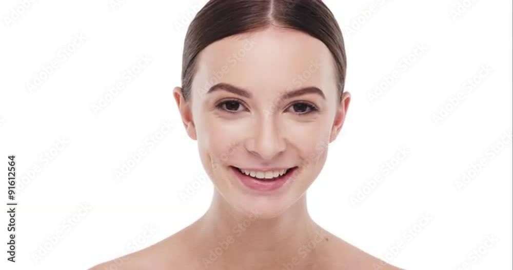 Beauty portrait of woman touching beautiful face in slow motion skincare concept on a white background Beauty portrait of woman touching beautiful face in slow motion skincare concept on a white background