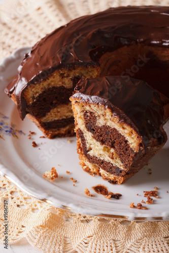 marble cake with chocolate chopped into pieces close-up. vertical 