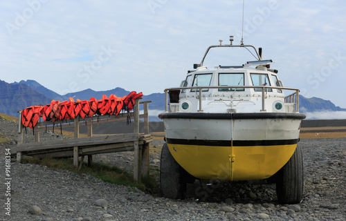 Amphibious vehecle for tourist excursions on the Jokulsarlon lagoon at shore, ready for tourists. photo