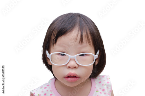 Little Asian girl wearing eyeglasses with suspect face