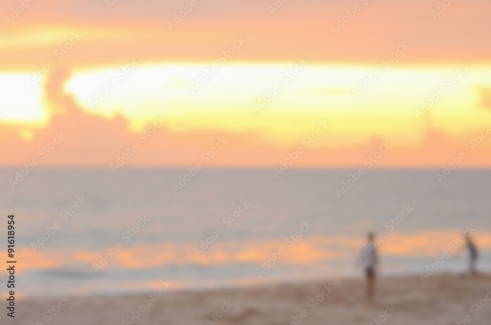Blur children playing on tropical sunset beach abstract background.