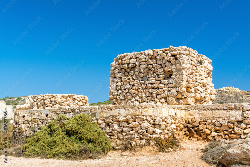 Unfinished tower on the Golden Bay beach in Malta