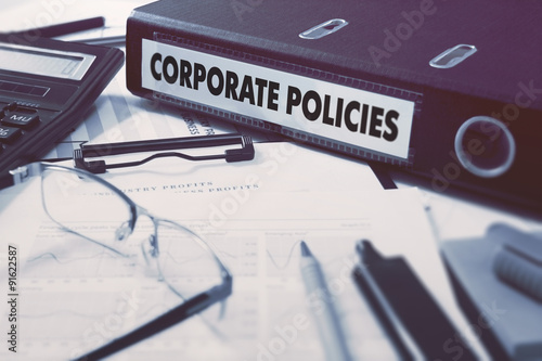 Corporate Policies on Office Folder. Toned Image.