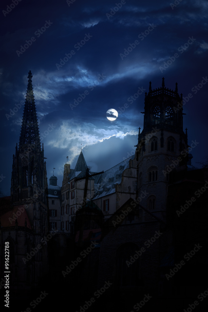 Mysterious medieval castle and the cathedral church at night