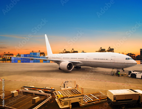 Fotografie air freight and cargo plane loading trading goods in airport con
