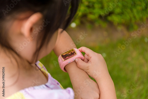 Child Using Smartwatch or Smart Watch / Child with Smartwatch or Smart Watch