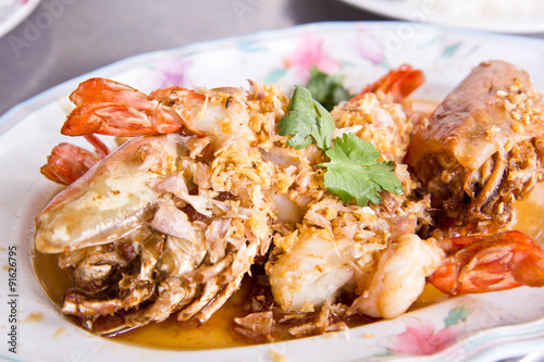 Stir shrimps with garlic on plate ,Thai seafood