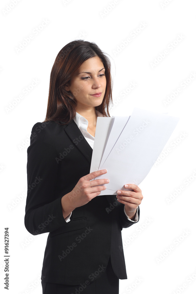 Serious business woman reading a report Serious business woman reading a report