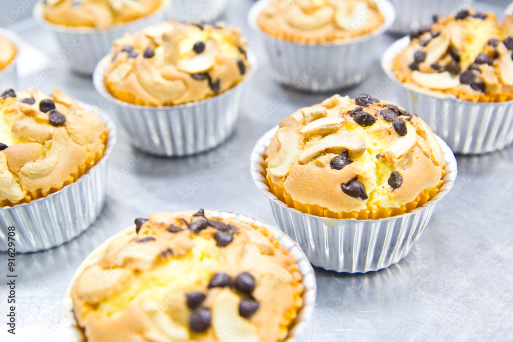 Muffin butter cakes with cashew nut and chocolate chips on top