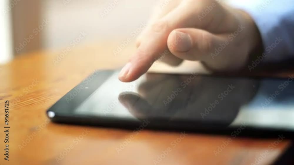 close-up hand using touchscreen touching finger tablet close-up hand using touchscreen touching finger tablet
