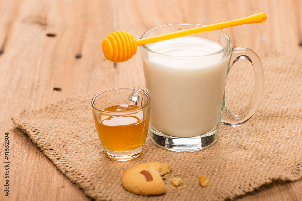 glass of milk with honey and cookie glass of milk with honey and cookie