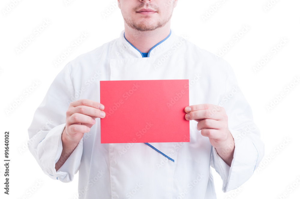 Chef or cook holding red paper card with copy space Chef or cook holding red paper card with copy space