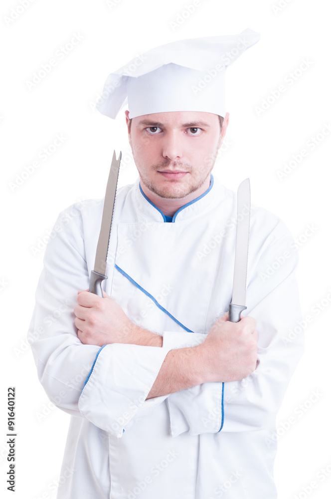 Skilled chef or cook holding two knifes or blades Skilled chef or cook holding two knifes or blades