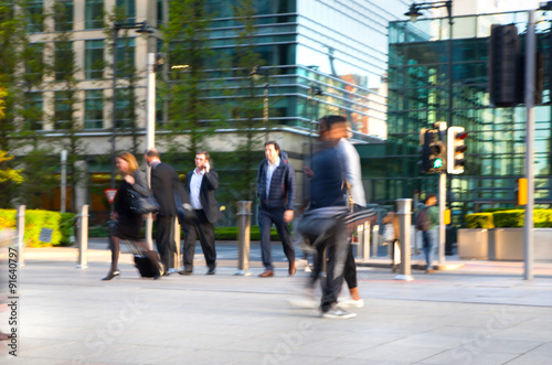 LONDON, UK - MAY 21, 2015: Canary Wharf business life. Business people going home after working day. Blur