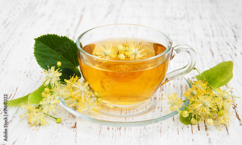 Cup of herbal tea with linden flowers