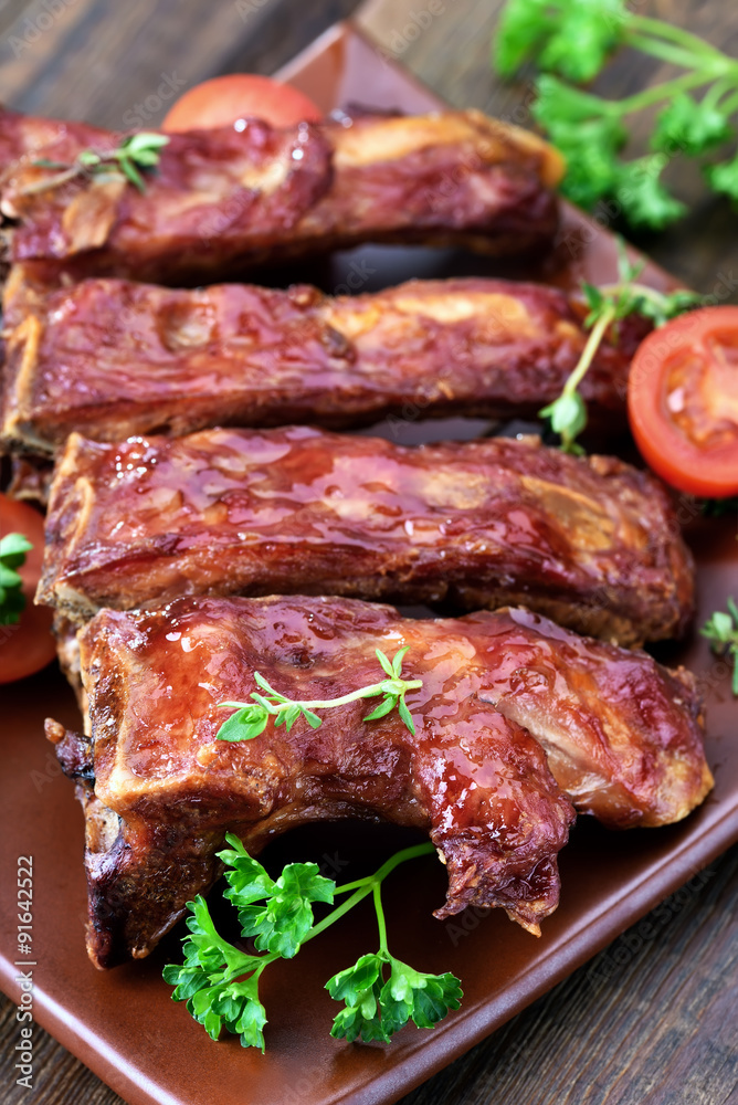 Grilled pork ribs on ceramic plate