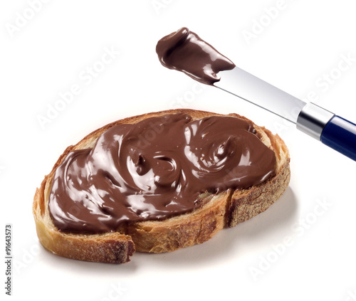 Spread a slice of bread with chocolate cream