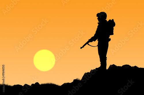 Silhouette of soldier with a gun