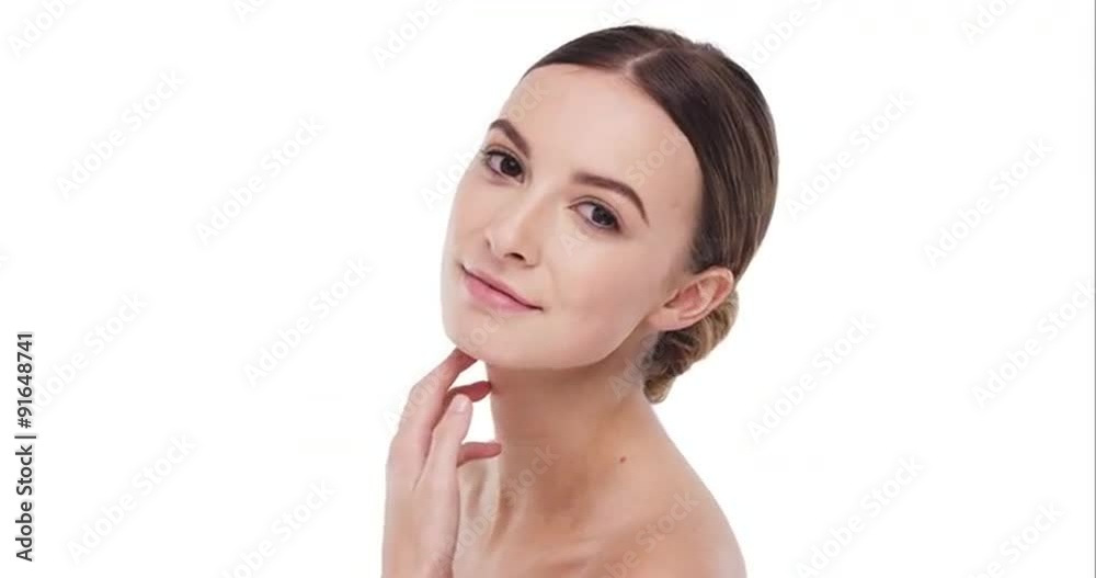 Beauty portrait of woman touching beautiful face in slow motion skincare concept on a white background Beauty portrait of woman touching beautiful face in slow motion skincare concept on a white background