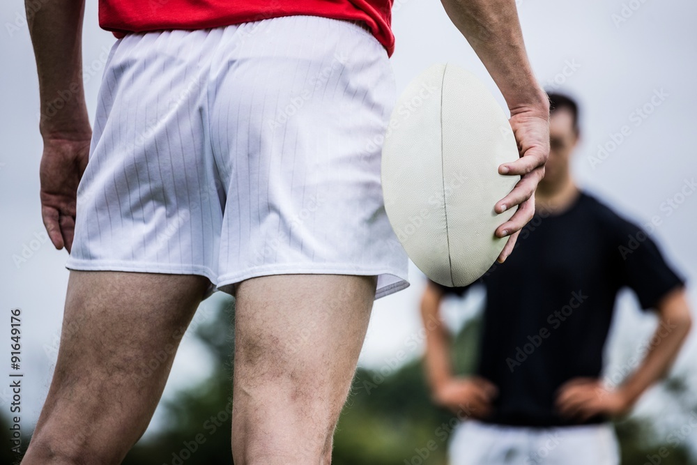 Fototapeta premium Rugby player standing with ball