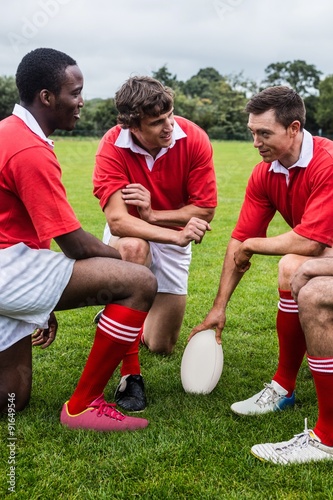 Rugby players discussing tactics before match © WavebreakMediaMicro