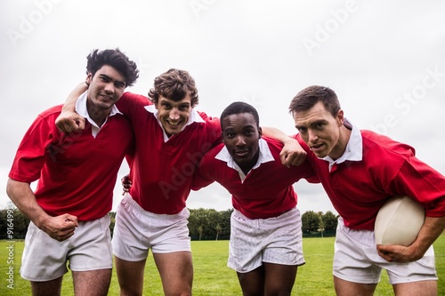 Rugby players putting hands together © WavebreakmediaMicro
