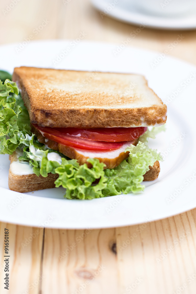 Healthy ham sandwich with cheese, tomatoes and lettuce Healthy ham sandwich with cheese, tomatoes and lettuce