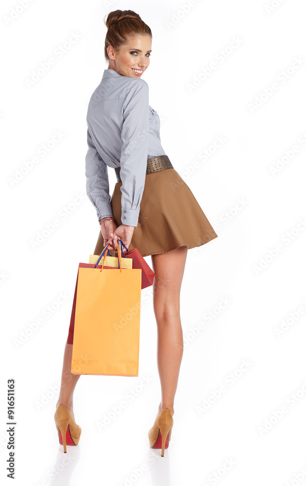 lovely woman with shopping bags over white lovely woman with shopping bags over white